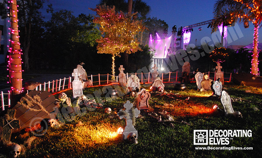 Commercial--Graveyard-Scene--Park-Setting-with-tombstones,-skeletons-and-wrapped-palm-trees-www.decoratingelves.com