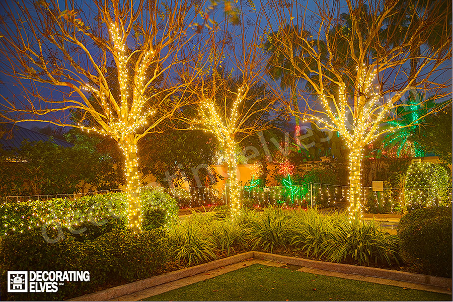 Crape-Mrtyles-in-a-garden-wrapped-with-mini-lights-www.decoratingelves.com