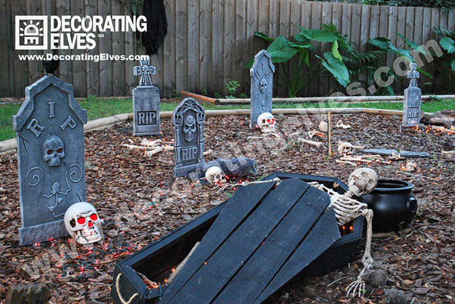 Halloween Décor with graveyard skeletons and coffin