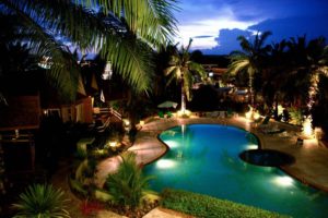 Outdoor accent lighting around a resort style pool